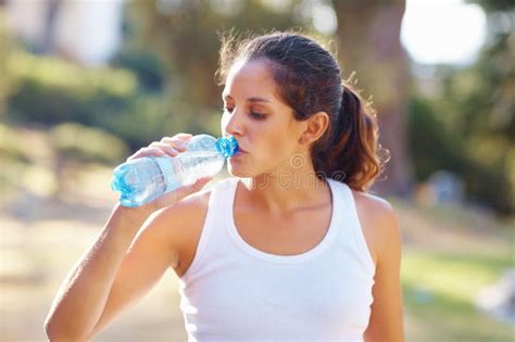 Water, Tired and Woman Thinking after Fitness, Training and Exercise for Body Motivation at the ...