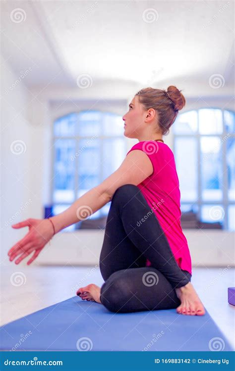 Seated Spinal Twist Yoga Pose Stock Photo - Image of activity, interior: 169883142