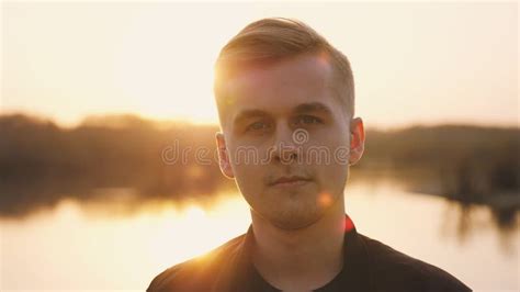 Portrait of Young Handsome Man Enjoying Sunlight during Sunset Stock ...