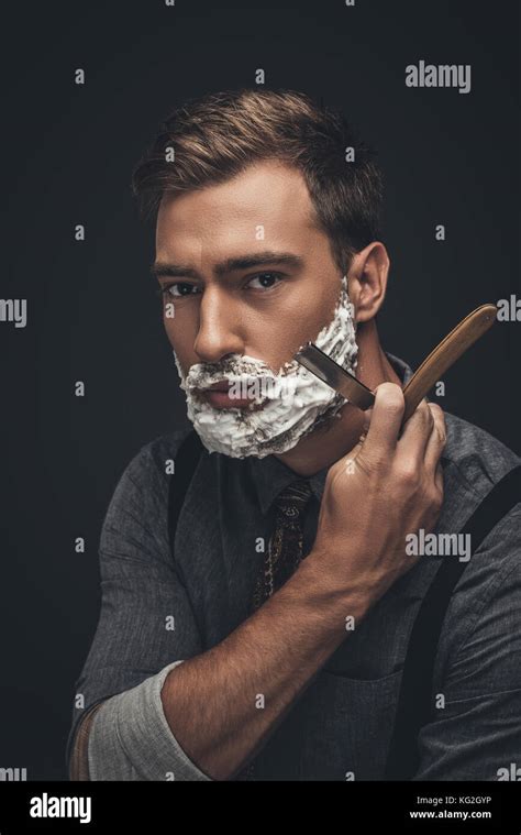 man shaving with straight razor Stock Photo - Alamy