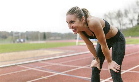 Athlete woman recovering after training stock photo