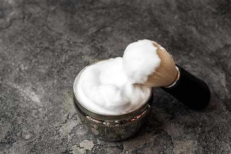 Shaving brush and cream on dark plaster background 3492699 Stock Photo ...