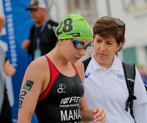 Download Triathlon Coach With Their Athlete Wallpaper | Wallpapers.com