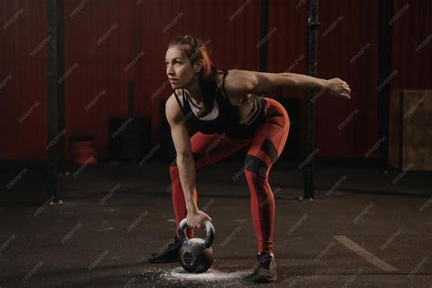 Premium Photo | Female athlete lifting heavy weights sports woman ...