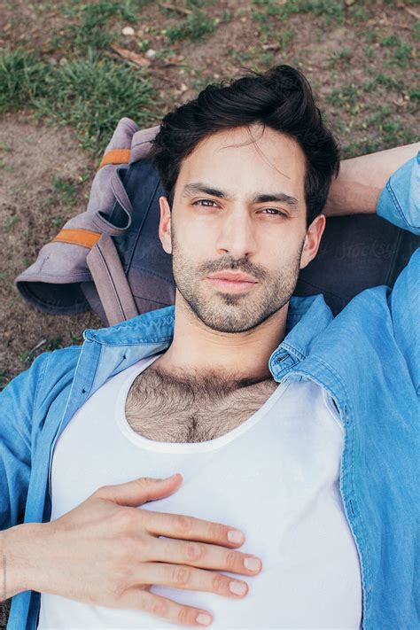 «Headshot Of Handsome Caucasian Man Lying In Park With Head On Backpack ...