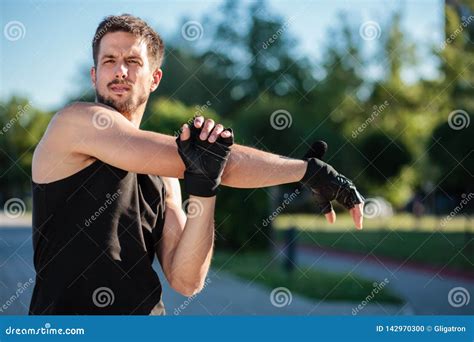 Young Man Stretching after the Workout Stock Photo - Image of ethnicity ...