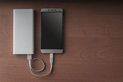Premium Photo | A modern smartphone and a connected power bank