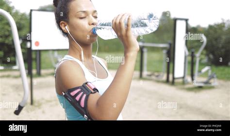 Fitness girl drinking water hi-res stock photography and images - Alamy