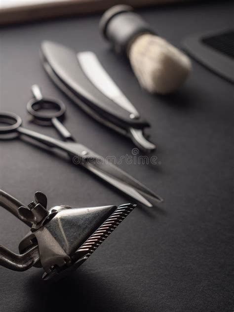 Classic Barber Tools Including Scissors, a Straight Razor, and a Shaving Brush are Neatly ...