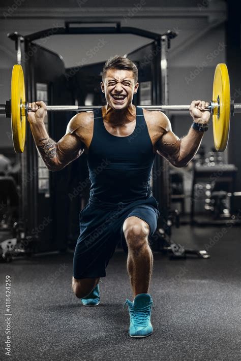 Handsome strong athletic men pumping up muscles workout fitness and ...