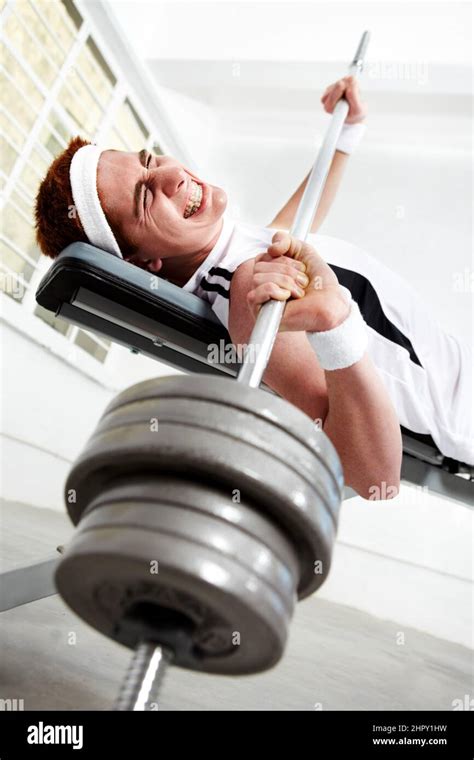 Man struggling to lift weights hi-res stock photography and images - Alamy