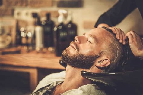 What is the optimal technique for maintaining a clean and sharp neckline on a short beard or stubble without creating an unnatural line?