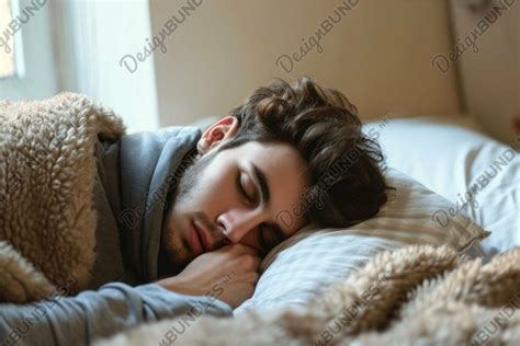 Peaceful young man sleeping soundly in cozy bed