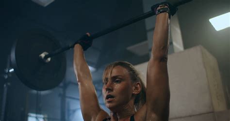 A Female Weightlifter Performs Barbell Lift Stock Footage SBV-338658615 ...