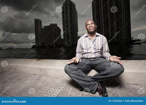 Man Meditating Outdoors at Night Stock Image - Image of building ...