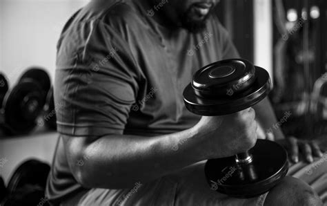 Free Photo | Man lifting weights at the gym