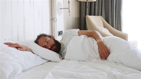 Little cute daughter comes to sleeping father at morning, and opens his ...