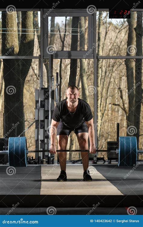 Deadlift Attempt. Young Man Trying To Lift Heavy Barbell Stock Photo ...