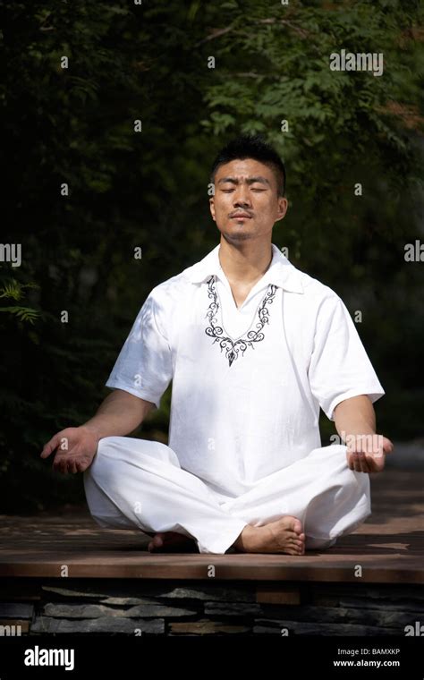 Man Meditating Outdoors Stock Photo - Alamy