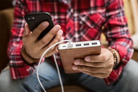 Premium Photo | Charging smartphone with power bank