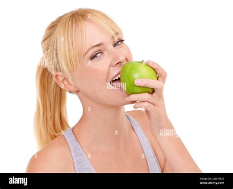 Studio, portrait and happy woman with apple for gut health, diet and nutrition benefits on white ...