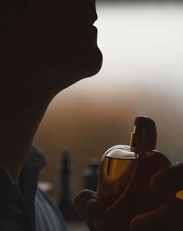 Man Applying Cologne Eau De Toilette On Neck Stock Photo - Download Image Now - Adult, Adults ...