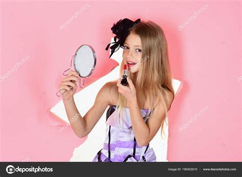 Child cosmetics. Little girl applying make up. — Stock Photo ...