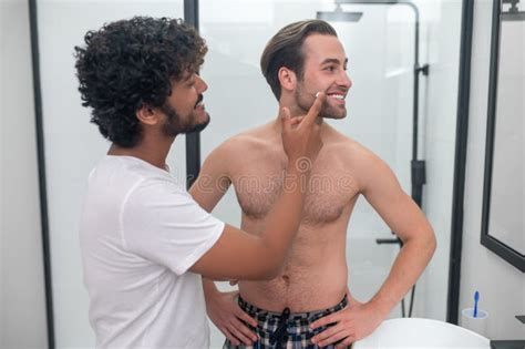Caring Man Preparing His Partner Skin for a Shave Stock Image - Image ...