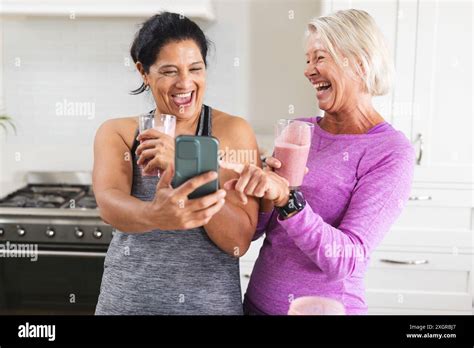 Drinking smoothies diverse female friends hi-res stock photography and ...