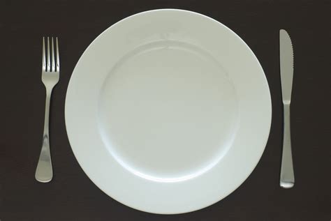Plain white clean empty dinner plate and cutlery - Free Stock Image