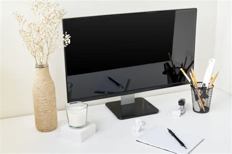 Premium Photo | Modern workspace with a monitor and a plant