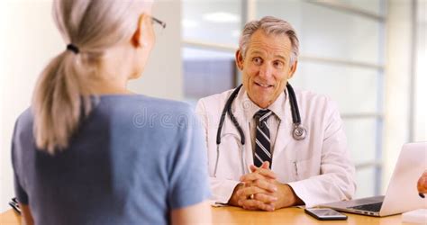 Senior Doctor Expressing Health Concerns with Elderly Man Patient Stock Image - Image of ...