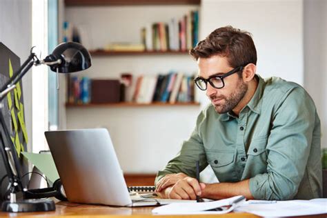 Best Person Sitting At Desk Stock Photos, Pictures &amp; Royalty-Free ...
