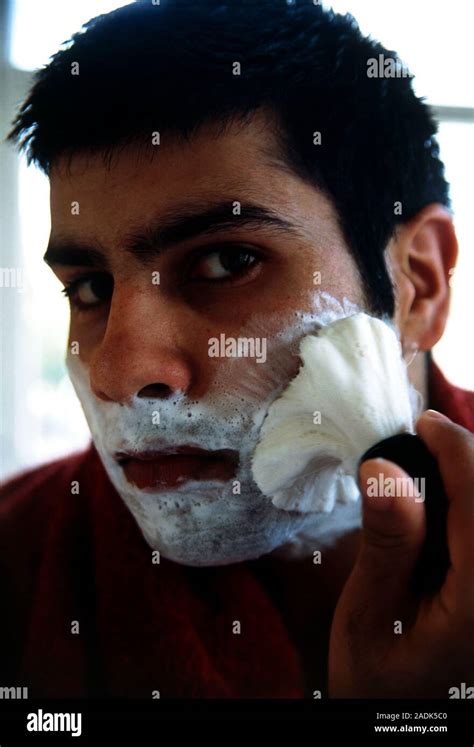 Man lathering face with brush before shaving Stock Photo - Alamy