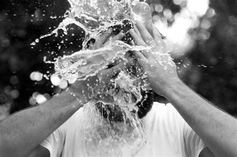 Premium Photo | Close-up of man washing face with water