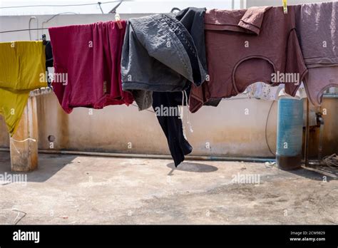Clean clothes hanging for dry. Home activity, laundry Stock Photo - Alamy
