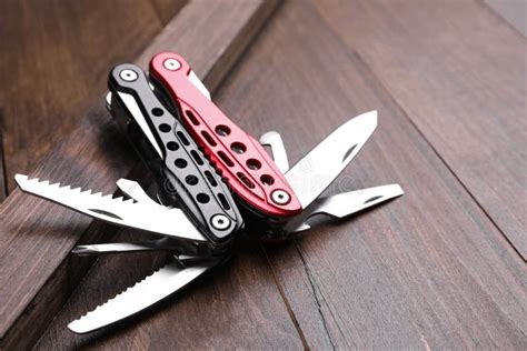 Modern Compact Portable Multitool on Wooden Table Stock Image - Image ...
