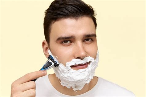 Free Photo | Close up image of handsome young dark haired man with ...