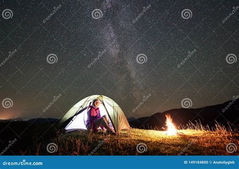 Woman Resting at Night Camping in Mountains Under Starry Sky Stock Photo - Image of outdoor ...
