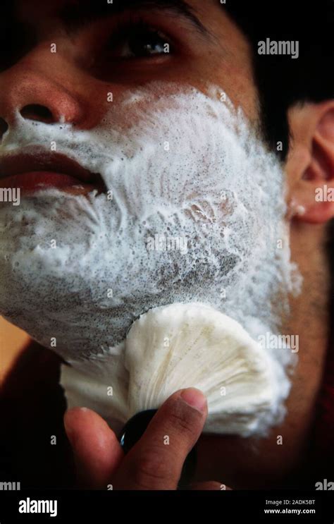 Man lathering face with brush before shaving Stock Photo - Alamy
