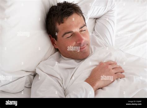 Man Sleeping Peacefully In Bed Stock Photo - Alamy