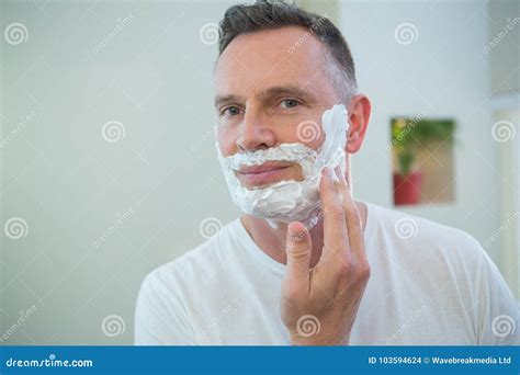 Man Applying Shaving Foam on His Face Stock Photo - Image of adult, cream: 103594624