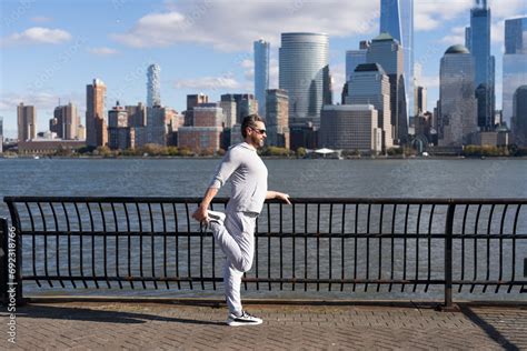 Athlete stretching to improve flexibility. Athlete stretching muscles ...