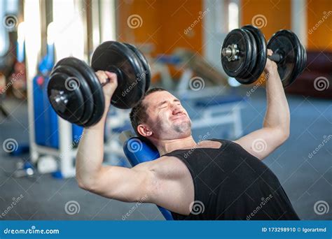 Strong Man Lifting Weight in Sport Club. Closeup Guy Training Muscles ...