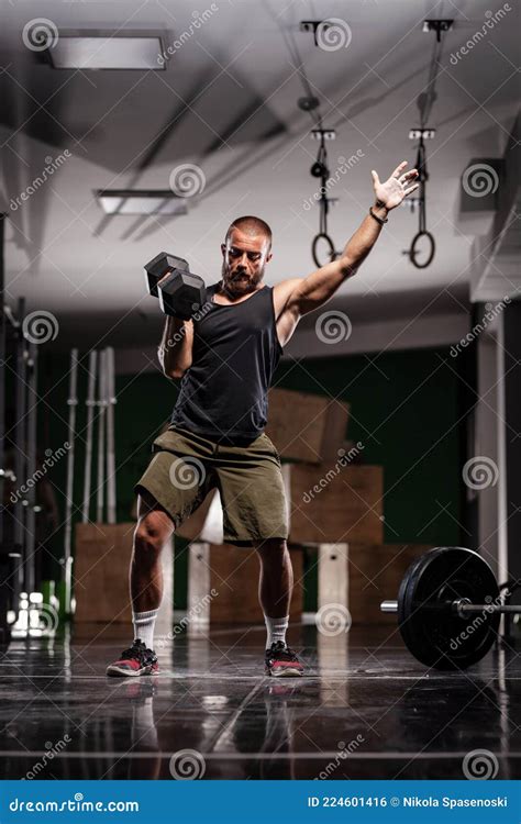 Muscular Athlete Lifting Very Heavy Weights. Man Working Out Indoors ...