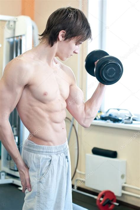 Powerful muscular man lifting weights in gym ⬇ Stock Photo, Image by ...