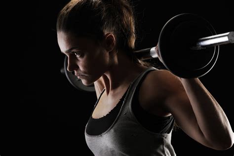 Download Brunette Woman Weight Lifting Wallpaper | Wallpapers.com
