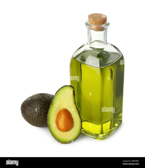 Vegetable fats. Bottle of cooking oil and fresh avocados isolated on ...