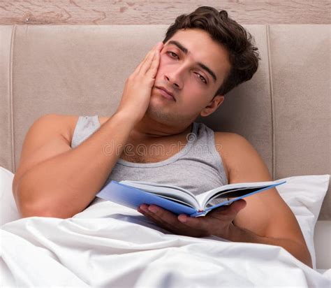 Man Reading Book in the Bed Stock Photo - Image of problem, morning ...