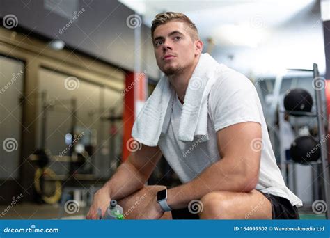 Male Athletic Relaxing in Fitness Center Stock Photo - Image of healthy, awareness: 154099502